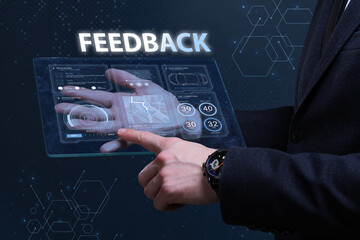 Business, Technology, Internet and network concept. Financial Graph. Stock Market chart. Young businessman working on a virtual screen of the future and sees the inscription: Feedback