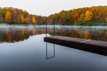 Fall Color and Fishing Pier Reflecting on Boley Lake, Babcock State Park, West Virginia, USA