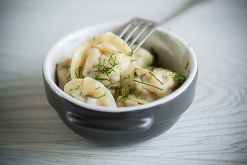 boiled dumplings with meat filling in a bowl
