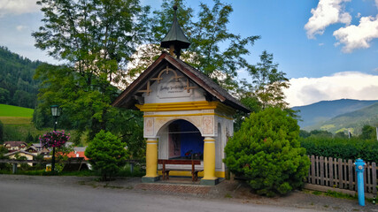 Fototapeta na wymiar Beautifully decorated village chapel in alpine region of Austria.