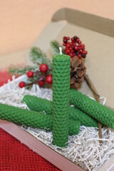Selective focus handmade bee wax candles green colour in the box. Bee candles good present for Christmas.