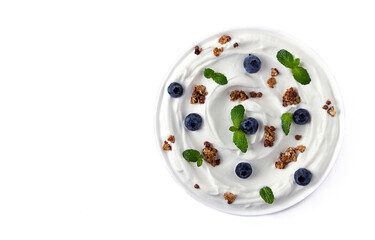 Yogurt with blueberries, granola and mint, top view, food background , close up, macro,