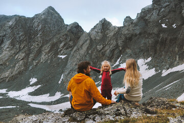 Child hiking with parents family travel vacations in mountains outdoor healthy lifestyle father and...