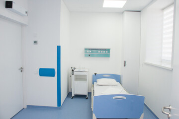 Empty modern hospital room with oxygen concentrator. Modern medical equipment in the intensive care...