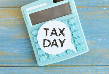 Tax Day words written on label with calculator,Business Concept