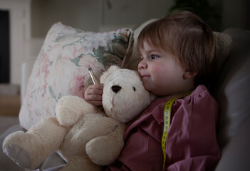 Girl hugging bear plush teddy bear