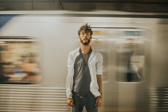 Man standing in front of speeding train