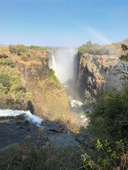 Fototapeta na wymiar Victoria Falls with Rainbow, Zimbabwe