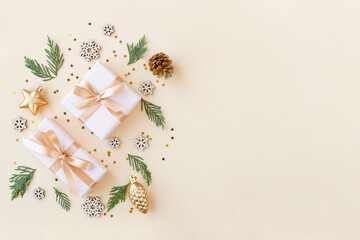 Christmas flat lay background with fir tree, two gift box and decorations. Free space , top view