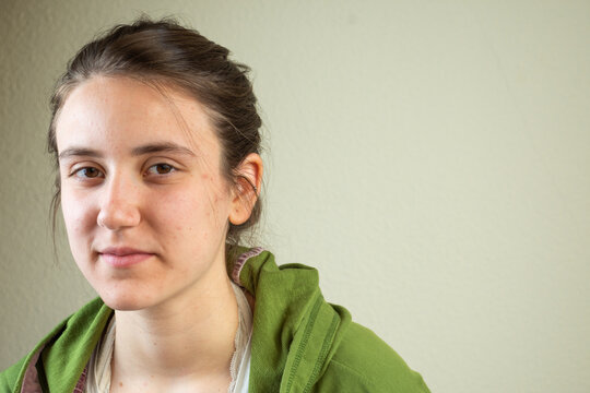 Portrait Of Teenage Girl In Green Shirt