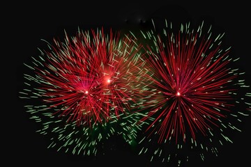Red and green fireworks display during nighttime