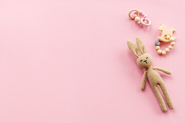 Baby toy rabbit with wooden accessories, overhead view