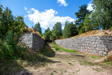 Fototapeta na wymiar The walls of the earthen ditch. Trongzund fortress. Vysotsk. Leningrad region. Russia