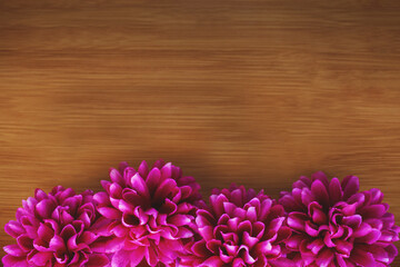 Purple flowers on wooden background, copy space. Floral arrangement of dahlias. Happy Mother's Day,...