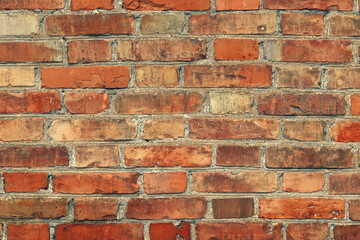 Obraz premium brick red wall. background of a old brick house.