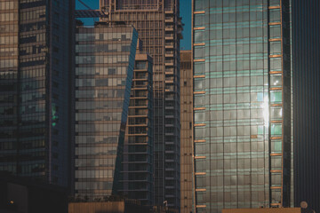 Fototapeta na wymiar Residential skyscrapers with direct sunlight