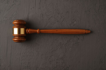Judge gavel on black textured background
