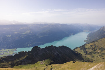 Obraz premium Amazing hiking day in the alps of Switzerland. Wonderful view over a beautiful lake called Brienzersee. What an amazing view.