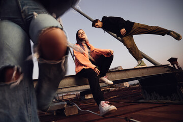Fototapeta na wymiar A teenagers hanging on rooftop and drinking beer.