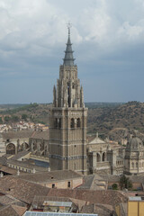 Fototapeta na wymiar Toledo cathedral tower seen from the bell tower of the Jesuit church in Toledo Spain