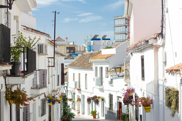 A typical street in old city Estepona with colorful flower pots. Estepona, Andalusia, Spain