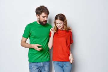 Fototapeta premium a young couple hug friendship colorful t-shirts family light background