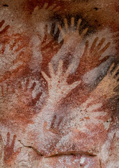Closeup shot of prehistoric rock art at the Cave of the Hands (Spanish: Cueva de Las Manos ) in...