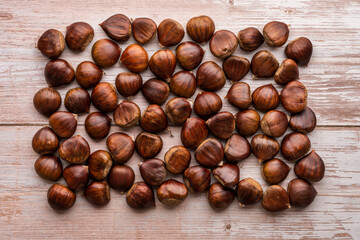 Bulk chestnuts on wooden table