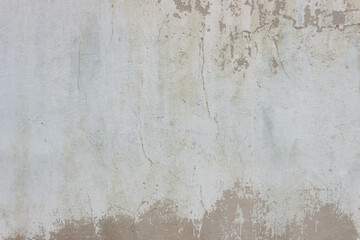 Beige crumbled concrete wall texture. Wonderful light-yellow backdrop.