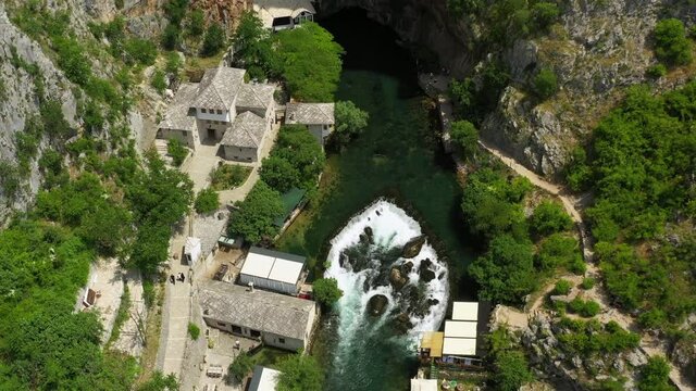 Aerial Beautiful Shot Of People Exploring At Vrelo Bune, Drone Flying Over Buna Lake - Blagaj, Bosnia and Herzegovina