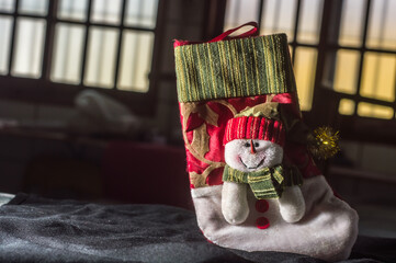 christmas concept with santa claus , angel , ornaments and plush , copy space and selective focus , dark background