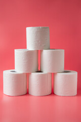 Toilet paper on pink background