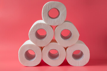 Toilet paper on pink background