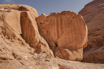 A large flat cracked stone with beautiful red veins in the Wadi Rum desert, Jordan