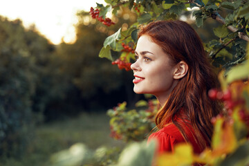 woman in red dress green leaves nature freedom summer