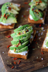 Avocado toast on a wooden board. Healthy food. The keto diet.
