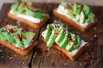 Avocado toast on a wooden board. Healthy food. The keto diet.