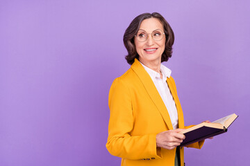 Profile photo of nice professor grey elder lady read book look empty space wear eyewear yellow...
