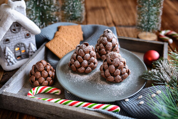 No bake chocolate Christmas pine cone sprinkled with powdered sugar