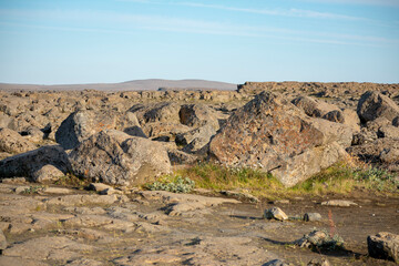 Landscape of moon like lava rocks at Detifoss Selfoss Entrance Diamond Circle Iceland
