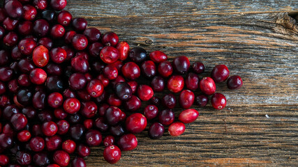 Cranberry background on rustic wooden background