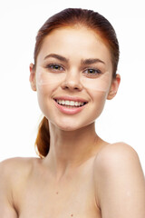 Obraz premium cheerful woman bare shoulders clear skin face mask