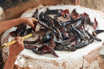 Documentary photography preparation of Oaxacan mole in Mexico, in a traditional way. Oaxacan tamales. Mexican food. Latin food. Spicy food.