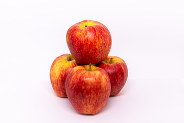 A bunch of red apples on a white background