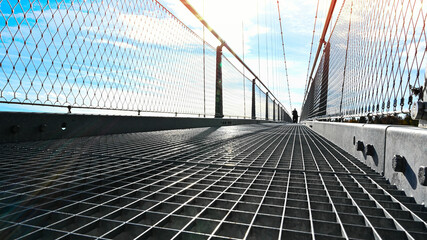 A modern pedestrian bridge with steel cable construction.