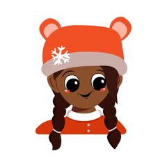 Girl with big eyes and a wide smile of African American or Latin nationality in bear hat with snowflake. Cute baby with happy face in winter headdress. Head of adorable child with emotions