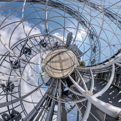 abstract swirling inside a metal frame tower alphabet into tiny planet
