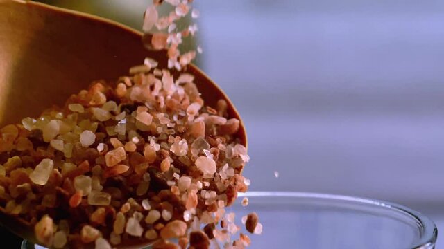 Himalayan pink salt pouring in slow motion
