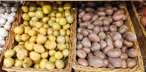 Potatoes are white and red on the supermarket counter. From Belarus and Egypt. Price increases....