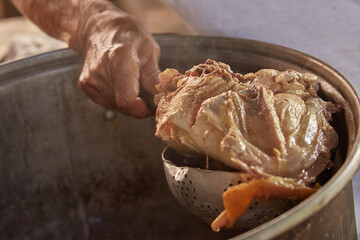 Documentary photography preparation of Oaxacan mole in Mexico, in a traditional way. Oaxacan tamales. Mexican food. Latin food. Spicy food.